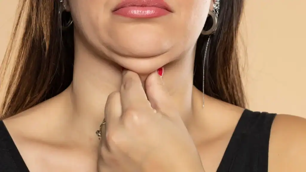 An image of a woman with double chin, sad, worried : Non Surgical Double Chin Removal Treatment in Bishopbriggs, UK